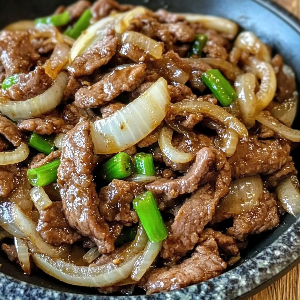Beef onion stir fry served over rice